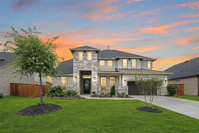 413 Stratus View Ct, Katy, TX 77493 - view of front of house with concrete driveway, a standing seam roof, an attached garage, stone siding, and metal roof