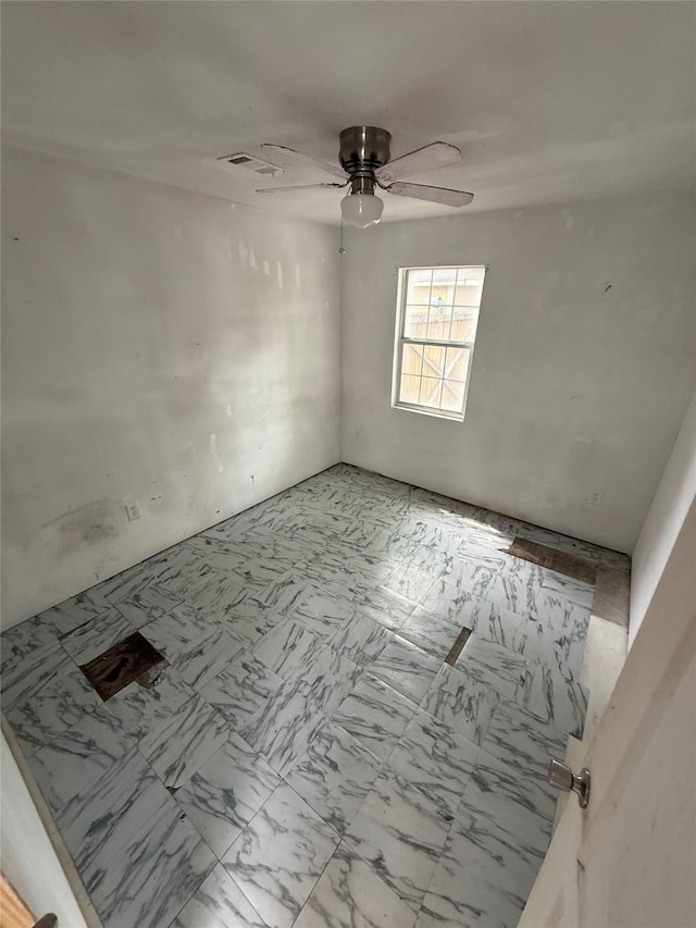 10211 Glenmawr Dr, Houston, TX 77075 - empty room featuring ceiling fan and light marble finish floors