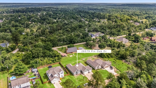 26579 Pin Oak Dr, Hempstead, TX 77445 - aerial view of property and surrounding area featuring a heavily wooded area and nearby suburban area
