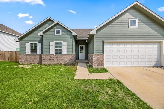 26579 Pin Oak Dr, Hempstead, TX 77445 - view of front of home with brick siding, concrete driveway, a garage, and roof with shingles