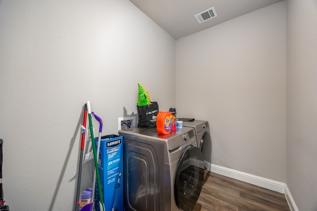 26579 Pin Oak Dr, Hempstead, TX 77445 - laundry area with separate washer and dryer, dark wood-style flooring, and baseboards
