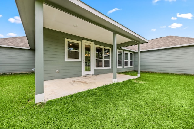 26579 Pin Oak Dr, Hempstead, TX 77445 - back of property featuring a patio area and a lawn