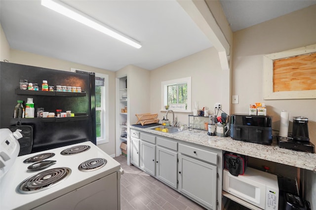 7477 Hidden Acres Dr, Cleveland, TX 77328 - kitchen with white appliances and lofted ceiling