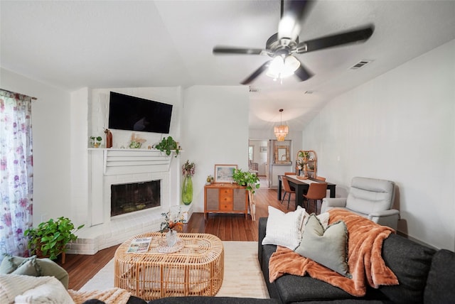 7477 Hidden Acres Dr, Cleveland, TX 77328 - living area featuring a fireplace, a ceiling fan, wood finished floors, and lofted ceiling