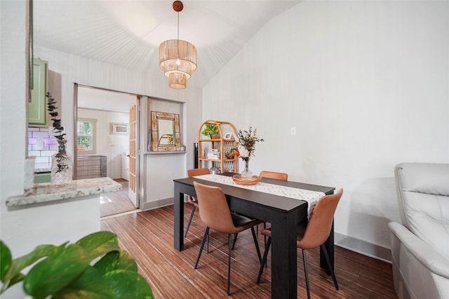 7477 Hidden Acres Dr, Cleveland, TX 77328 - dining room featuring a chandelier, wood finished floors, and vaulted ceiling