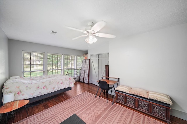 7477 Hidden Acres Dr, Cleveland, TX 77328 - bedroom featuring wood finished floors, a closet, and a ceiling fan