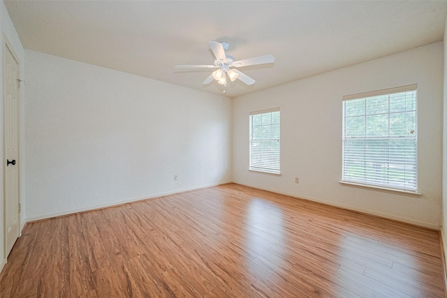 3614 Bee Bayou Ln, Sugar Land, TX 77479 - empty room with light wood-type flooring, a ceiling fan, and baseboards