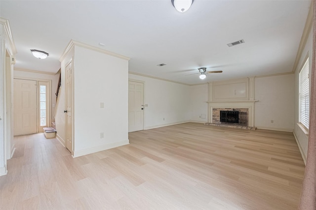 3614 Bee Bayou Ln, Sugar Land, TX 77479 - unfurnished living room with ornamental molding, light wood-style floors, ceiling fan, baseboards, and a fireplace