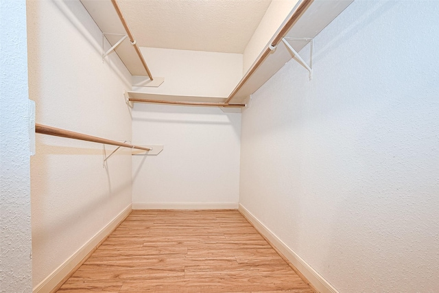 3614 Bee Bayou Ln, Sugar Land, TX 77479 - walk in closet featuring wood finished floors