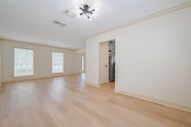 3614 Bee Bayou Ln, Sugar Land, TX 77479 - unfurnished room with crown molding, a textured ceiling, light wood finished floors, and baseboards