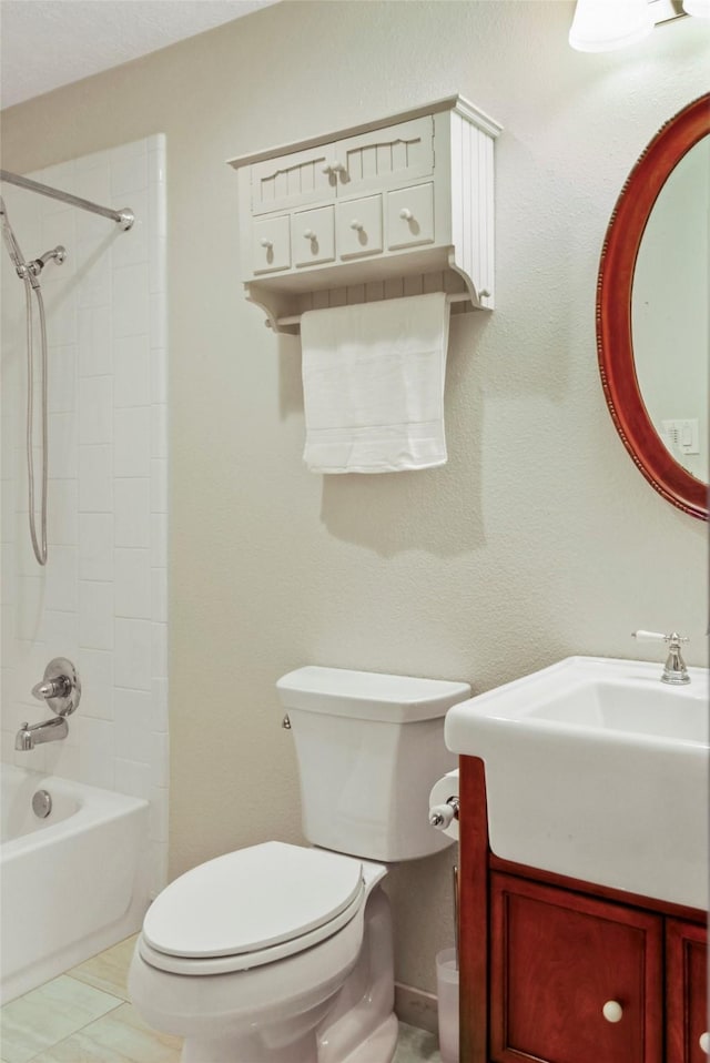 bathroom featuring toilet, vanity, and tub / shower combination