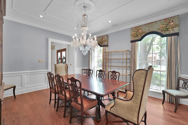 11774 Quail Creek Dr, Houston, TX 77070 - dining space with a chandelier, plenty of natural light, ornamental molding, a wainscoted wall, and wood finished floors