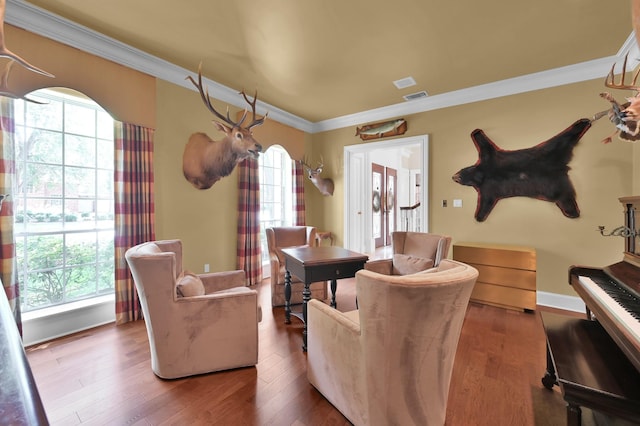11774 Quail Creek Dr, Houston, TX 77070 - living area with crown molding, plenty of natural light, wood finished floors, and baseboards