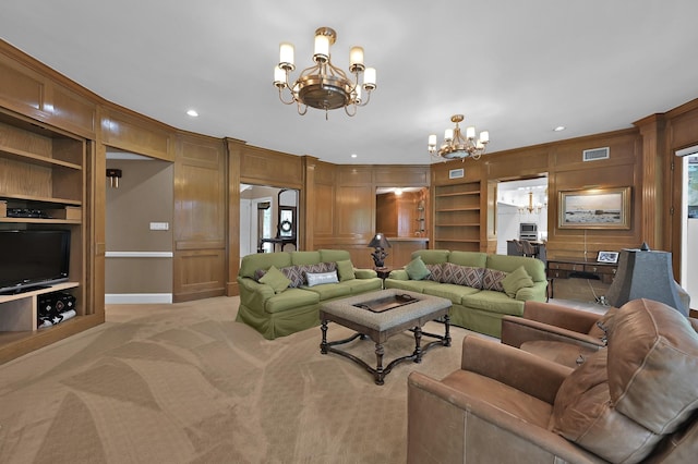 11774 Quail Creek Dr, Houston, TX 77070 - living room featuring a chandelier, built in shelves, light carpet, baseboards, and wooden walls