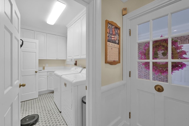 11774 Quail Creek Dr, Houston, TX 77070 - washroom with cabinet space, washer and clothes dryer, light flooring, and wainscoting