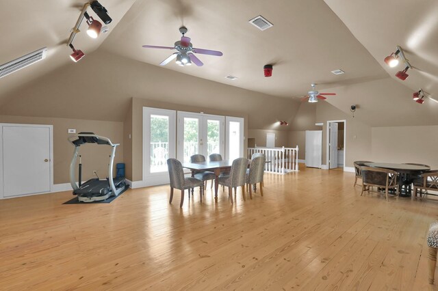 11774 Quail Creek Dr, Houston, TX 77070 - dining room featuring lofted ceiling, a ceiling fan, rail lighting, and light wood finished floors