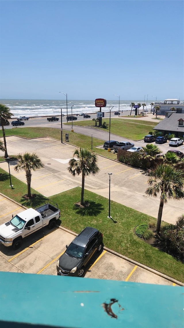 6102 Seawall Blvd Unit 358, Galveston, TX 77551 - view of property's community with a water view and uncovered parking