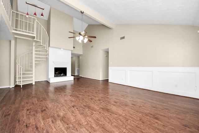 1115 Vang Ct, Crosby, TX 77532 - unfurnished living room featuring a ceiling fan, stairway, wood finished floors, beam ceiling, and wainscoting