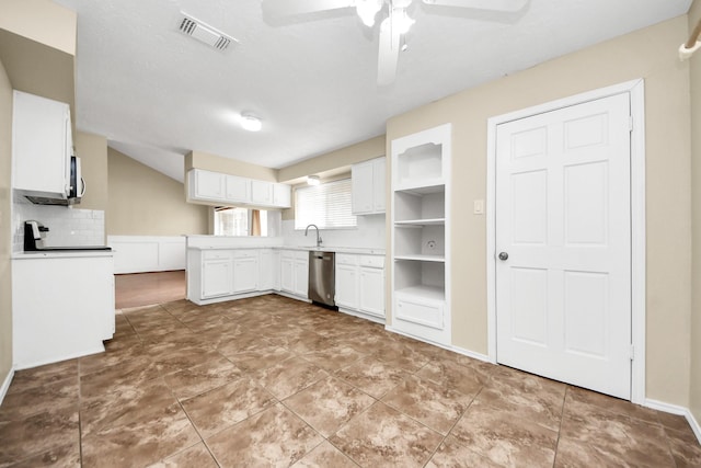 1115 Vang Ct, Crosby, TX 77532 - kitchen with stainless steel dishwasher, tasteful backsplash, white cabinets, ceiling fan, and white microwave