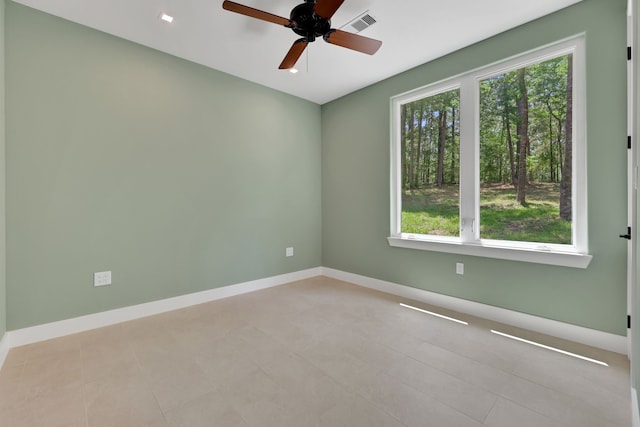 777 S Cape Royale Dr, Coldspring, TX 77331 - spare room with healthy amount of natural light, a ceiling fan, and baseboards