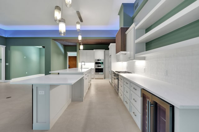777 S Cape Royale Dr, Coldspring, TX 77331 - kitchen featuring appliances with stainless steel finishes, wine cooler, open shelves, backsplash, and a large island with sink