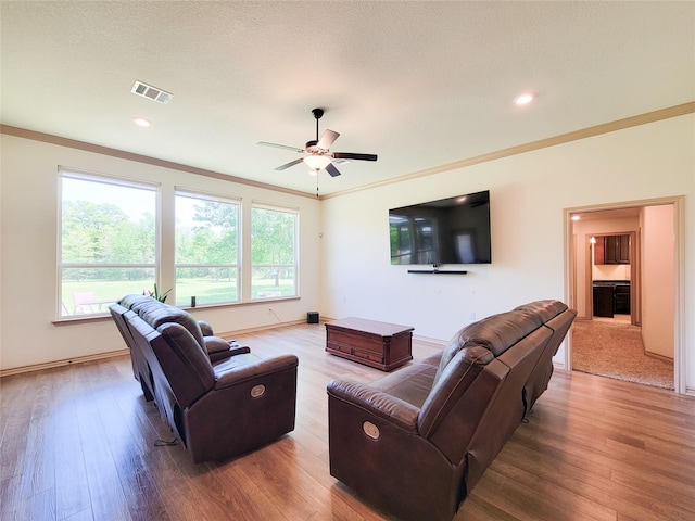 2755 Overlook Rd, Caldwell, TX 77836 - living room featuring a ceiling fan, wood finished floors, ornamental molding, baseboards, and recessed lighting