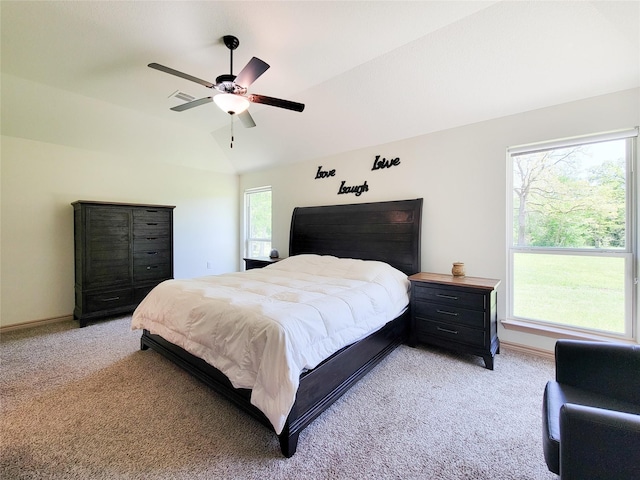 2755 Overlook Rd, Caldwell, TX 77836 - bedroom with light colored carpet, vaulted ceiling, a ceiling fan, and baseboards