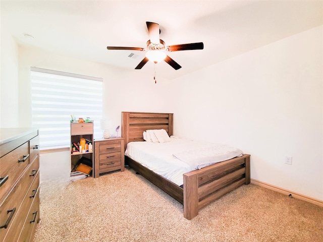 2755 Overlook Rd, Caldwell, TX 77836 - bedroom featuring light carpet, ceiling fan, and baseboards