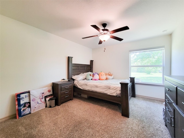 2755 Overlook Rd, Caldwell, TX 77836 - bedroom featuring light carpet, baseboards, and a ceiling fan
