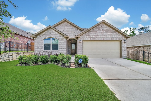 922 Golden Willow Ln, Conroe, TX 77304 - french provincial home featuring brick siding, a garage, and concrete driveway
