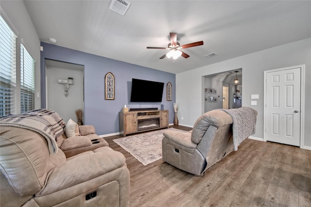 922 Golden Willow Ln, Conroe, TX 77304 - living room with wood finished floors, ceiling fan, and baseboards