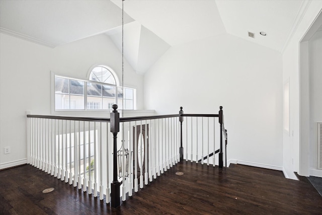 3007 Sackett St, Houston, TX 77098 - corridor with wood finished floors, vaulted ceiling, an upstairs landing, and baseboards