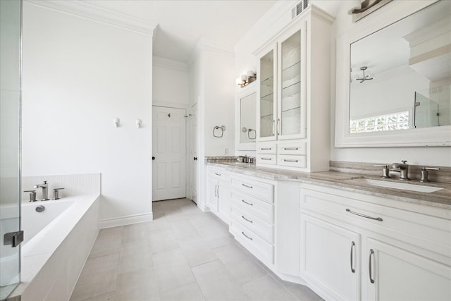 3007 Sackett St, Houston, TX 77098 - full bathroom featuring double vanity, a bath, ornamental molding, a shower with door, and tile patterned flooring
