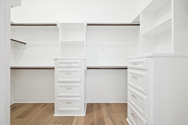3007 Sackett St, Houston, TX 77098 - walk in closet with light wood-style floors