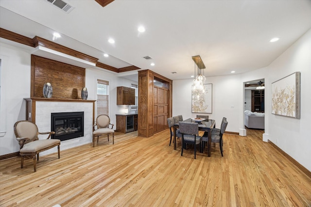 1010 Cortlandt St, Houston, TX 77008 - dining space featuring a fireplace, light wood-style floors, recessed lighting, baseboards, and a ceiling fan