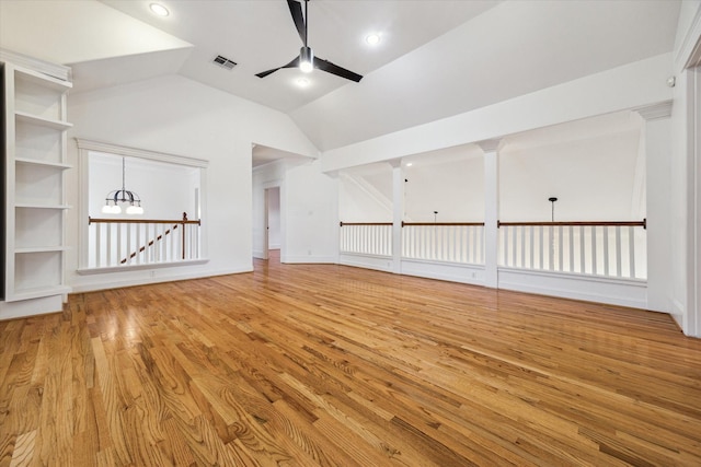 1010 Cortlandt St, Houston, TX 77008 - unfurnished living room with a ceiling fan, wood finished floors, a chandelier, and lofted ceiling