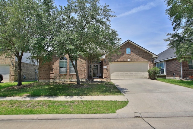 2414 Hannover Valley Ct, Spring, TX 77388 - view of front of house with brick siding, an attached garage, driveway, and a front lawn