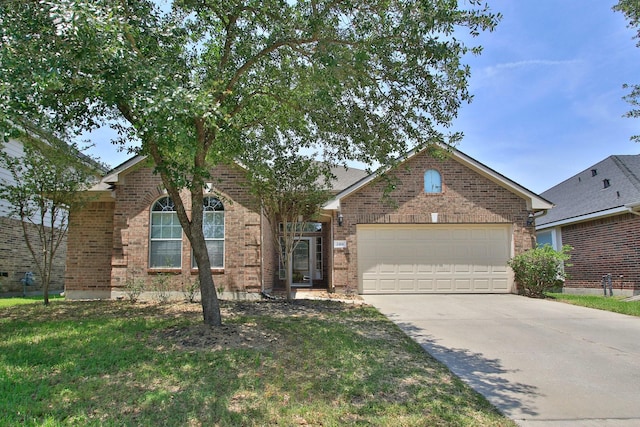 2414 Hannover Valley Ct, Spring, TX 77388 - view of front facade featuring brick siding, a garage, and driveway