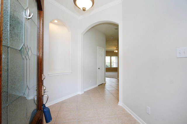 2414 Hannover Valley Ct, Spring, TX 77388 - hallway with light tile patterned floors, arched walkways, baseboards, and ornamental molding