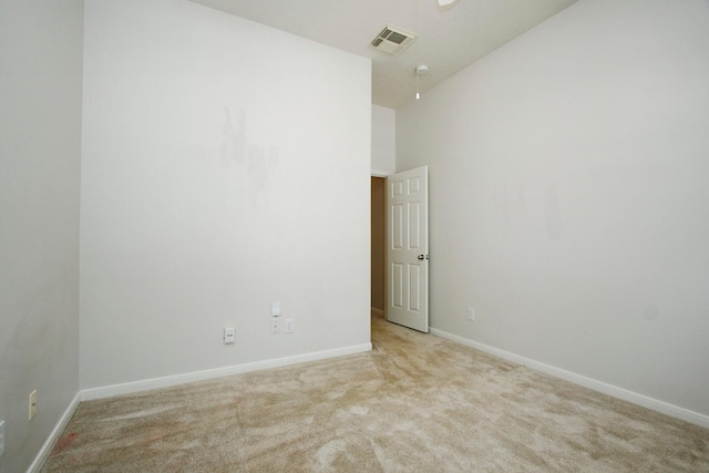 2414 Hannover Valley Ct, Spring, TX 77388 - spare room featuring light carpet, baseboards, and a towering ceiling