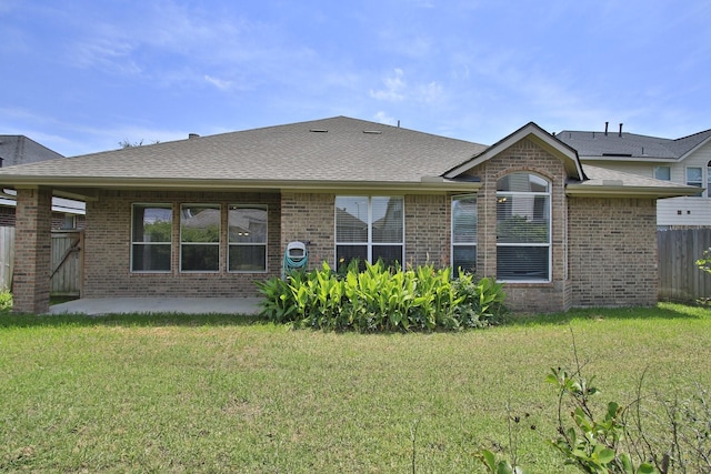 2414 Hannover Valley Ct, Spring, TX 77388 - rear view of house featuring brick siding, a patio area, and roof with shingles