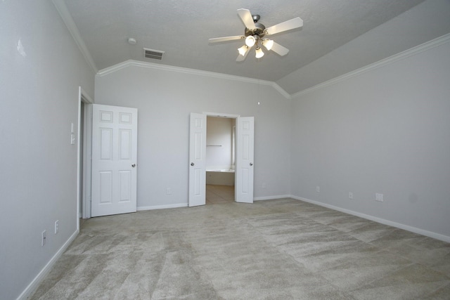 2414 Hannover Valley Ct, Spring, TX 77388 - unfurnished bedroom featuring lofted ceiling, light colored carpet, ornamental molding, baseboards, and connected bathroom
