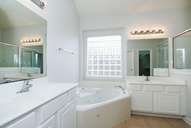 2414 Hannover Valley Ct, Spring, TX 77388 - full bathroom featuring tile patterned flooring, a stall shower, a whirlpool tub, and two vanities