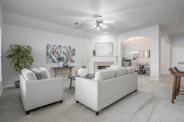 2414 Hannover Valley Ct, Spring, TX 77388 - living area featuring light colored carpet, arched walkways, a ceiling fan, and baseboards