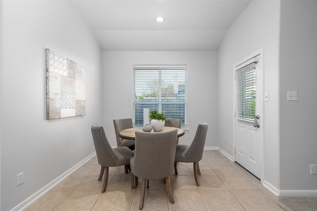 2414 Hannover Valley Ct, Spring, TX 77388 - dining area featuring healthy amount of natural light, light tile patterned floors, lofted ceiling, and baseboards