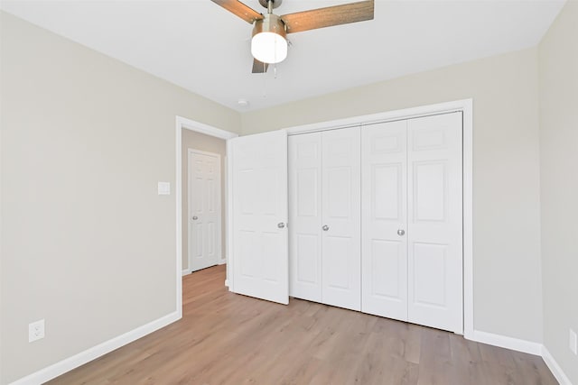 6334 Cambridge Glen Ln, Houston, TX 77035 - unfurnished bedroom with light wood-style floors, baseboards, and a closet