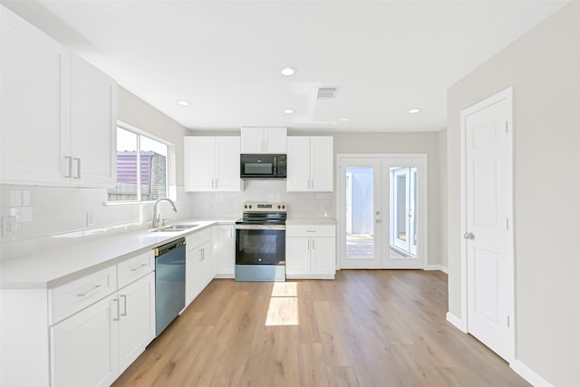 6334 Cambridge Glen Ln, Houston, TX 77035 - kitchen with black microwave, stainless steel electric range, a sink, dishwasher, and tasteful backsplash