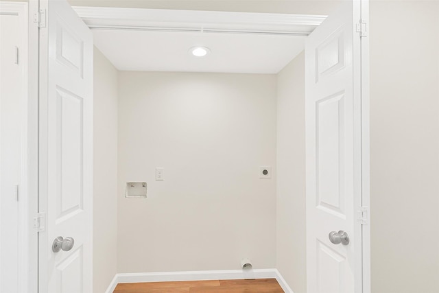6334 Cambridge Glen Ln, Houston, TX 77035 - washroom featuring electric dryer hookup, baseboards, light wood finished floors, and recessed lighting