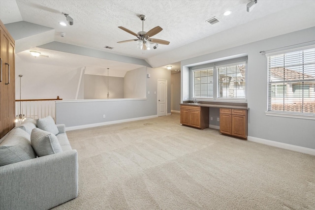 1435 Springrock Ln Unit C, Houston, TX 77055 - sitting room featuring ceiling fan, light carpet, a textured ceiling, and baseboards