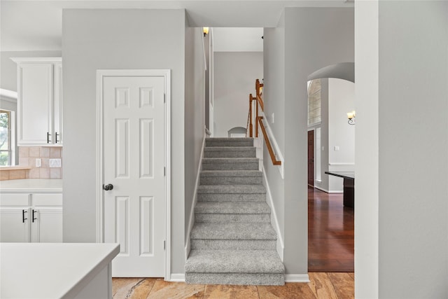 3427 Powell Way, Missouri City, TX 77459 - staircase featuring arched walkways